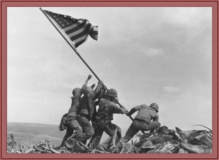 Six US Marines raise the American flag on Mount Suribachi on Iwo Jima, February 23, 1945.