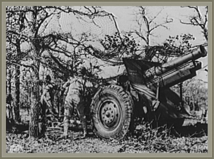 The 155mm howitzer, firing on the Fort Sill, Oklahoma Artillery Range in a 1943 training exercise, provides a mass of heavy, high-angle firepower.